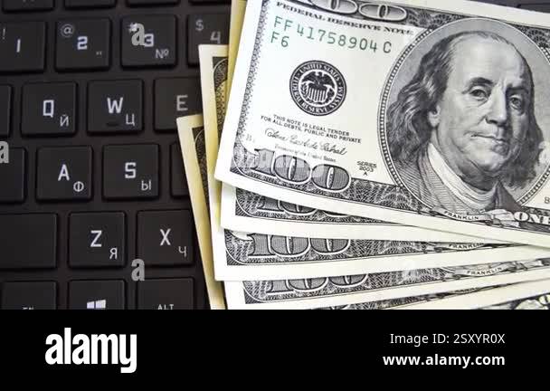 Dollars on keyboard computer. Money in internet and earnings concept ...