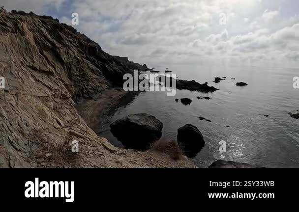 A breathtaking view of the coast of Spain, with its rugged cliffs, dry ...