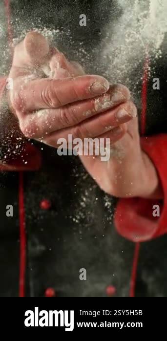 Super Slow Motion of a Baker Clapping His Hands and Throwing Flour ...