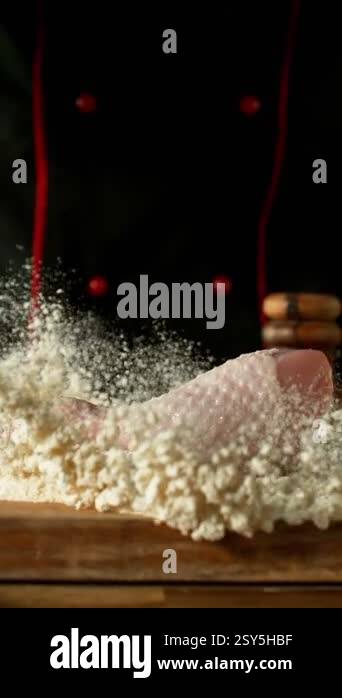 Super Slow Motion of Chef Throwing Raw Chicken Legs into Flour. Filmed ...