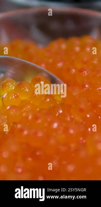 Red Caviar in a spoon background. Close-up of salmon fish roe caviar ...