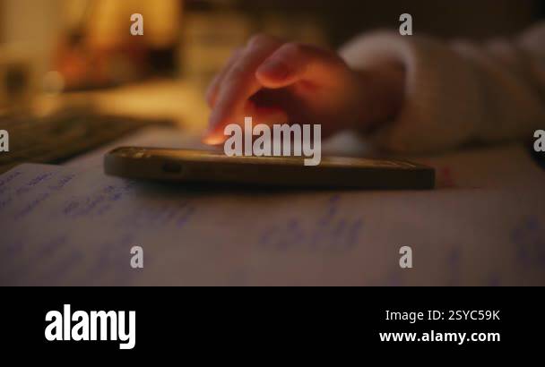 A strong close up of a woman hand scrolling through social media on her ...