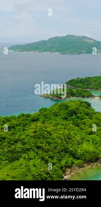Island with sandy beaches and houses in Alad Island. Romblon ...