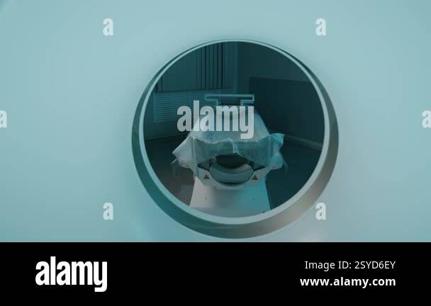 Rear view of hi-tech tomography machine in clinic or hospital, sliding ...