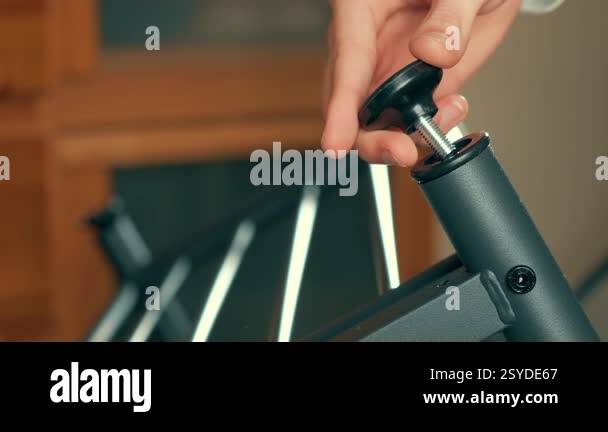 Installing adjustable foot on shoe rack, securing proper leveling ...