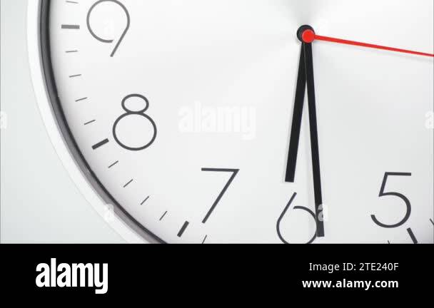 Time lapse White wall clock shows the running of time The movement of Time lapse White wall clock shows the running of time The movement of
