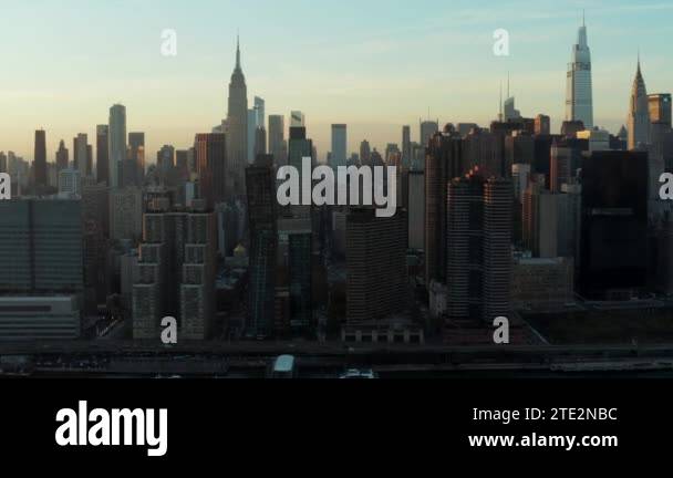 High rise buildings in midtown. Iconic Empire state building towering ...