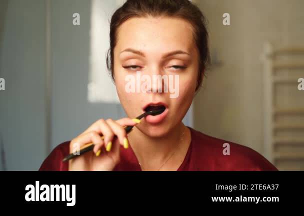 Pretty young woman cleaning teeth Stock Videos & Footage - HD and 4K ...