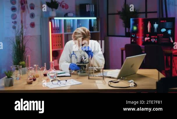 Beautiful confident qualified bright blond female chemist in lab coat ...