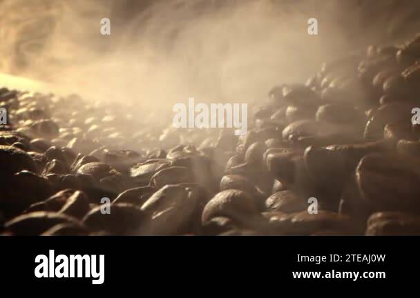 Macro shot roasting coffee beans, filmed in a dark key the smoke ...