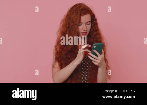 Unhappy Sad Young Redhead Woman Use Smartphone Typing Browsing Loses