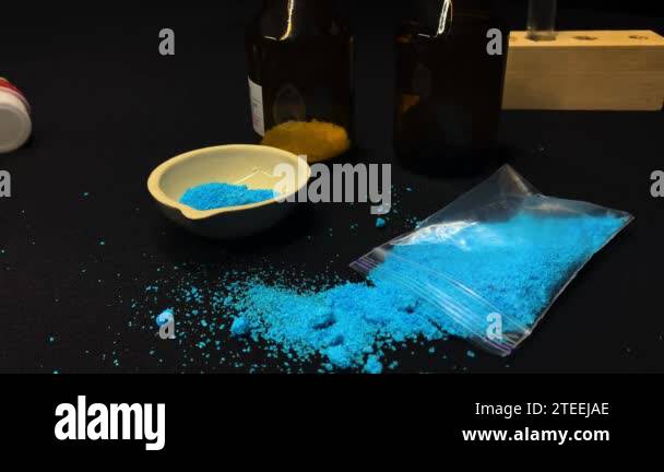 Lab footage, experiments with blue reagents, heating test tubes and ...