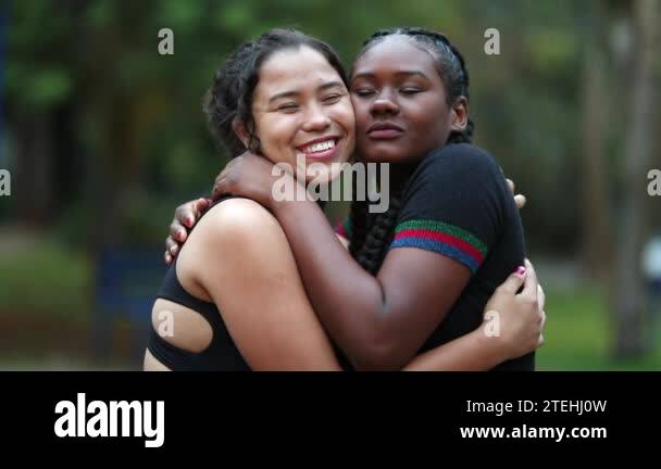 Diverse female friends hugging each other. Multiracial women embracing ...
