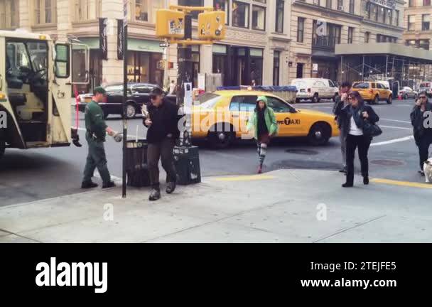 Busy City Life On The Streets While Garbage Collectors Put Trash In A Garbage Truck Stock Video