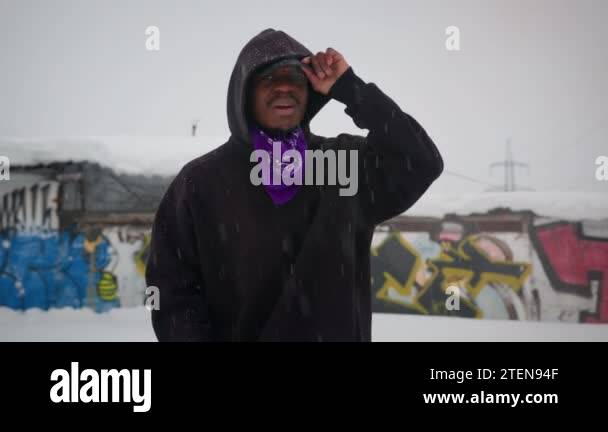 Slow-motion portrait an African American rapper singing rap on street ...