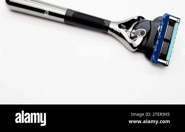 Modern Day Razor Modern men's razor with a lot of blades on a white background. Gift for ...