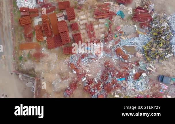 bird's-eye view of demolition site of building. concrete and rebar are ...