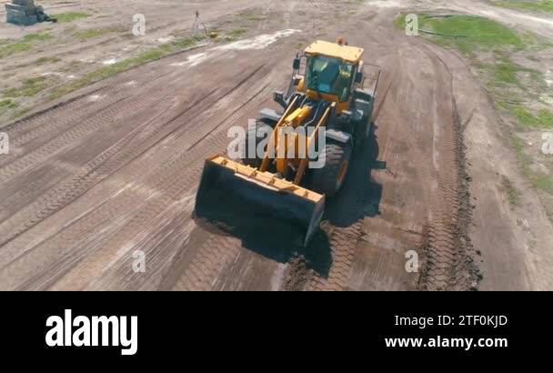 Bulldozer works at a construction site. Working process at a ...