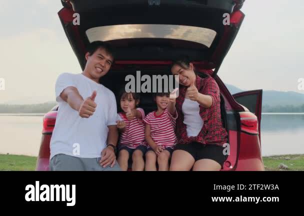 Happy family enjoying road trip on summer vacation. The family travels ...