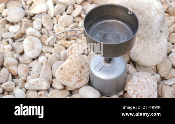 Boiling Water in Lightweight Titanium Pot on Gas burner Stove. Cooking ...