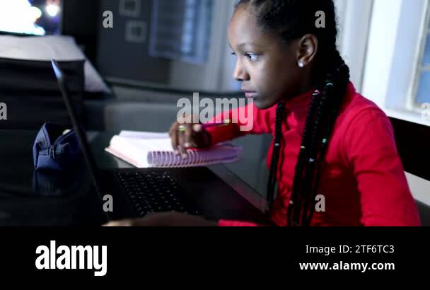 Candid black girl studying at night in front of laptop computer Stock ...