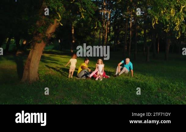 Sunny day in the park happy family enjoy the moment together two funny ...