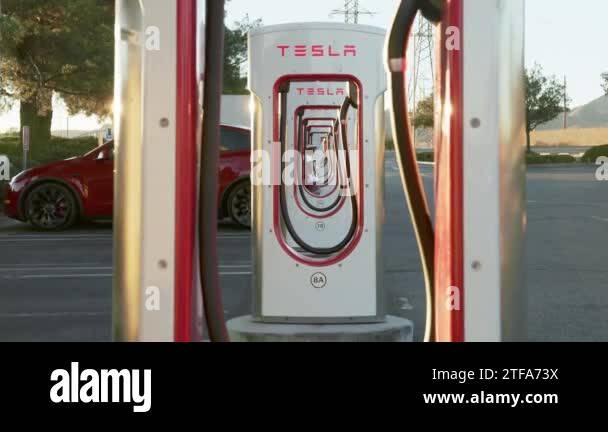 Tesla electric car charging in street, supercharger station for ...