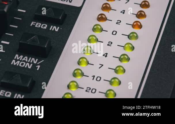 LED indicator of sound level signal on the mixing console. Close-up ...
