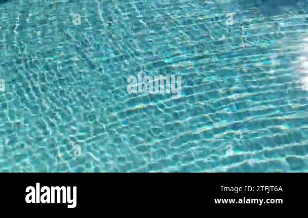 Water surface texture, Slow motion looping clean swimming pool ripples ...