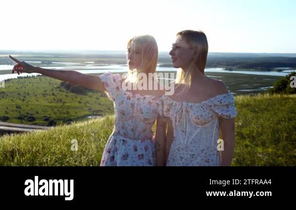 Two young women standing side by side Stock Videos & Footage - HD and ...