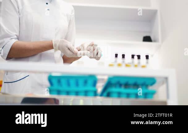 Mixing blood in test tubes. Inverting test tubes with blood. Prevent ...