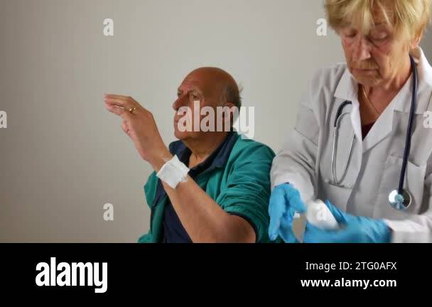 fractures in the limbs. doctor who checks, treats, wraps a patient to ...