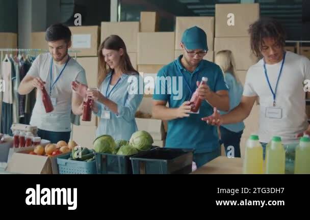 The Concept of Social Aid. Group of Volunteers Preparing Free Food ...