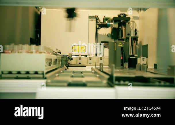 Automated laboratory for blood testing. Moving line with test tubes ...