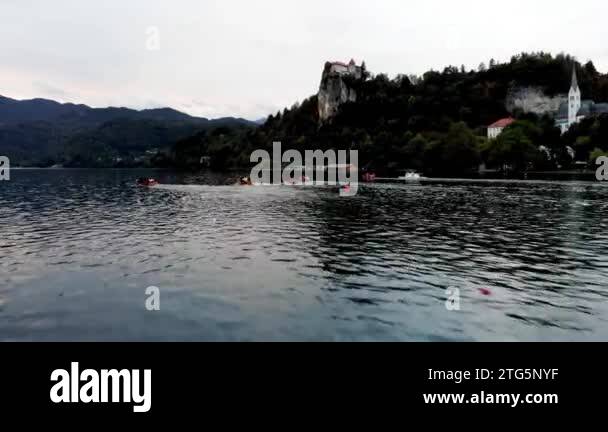 A shot from a drone of a rowing competition. Bled Castle. Drone view of ...