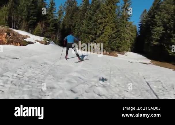 an athlete does cross country skiing workout on a beautiful morning