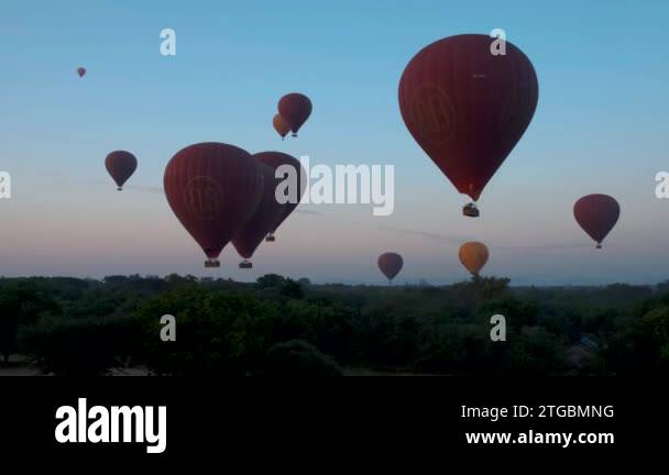 Bagan Myanmar, hot air balloon during Sunrise above temples and pagodas ...