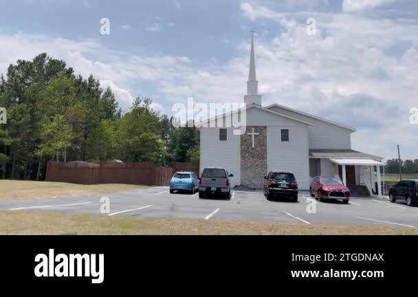 Hephzibah, Ga USA - 06 24 22: FBI raided Church Assembly of Prayer on Old Tobacco  Road side building pan POV Stock Video Footage