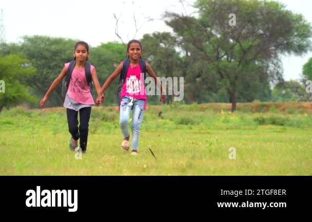 Back to school. Happy Indian rural school student going to school ...