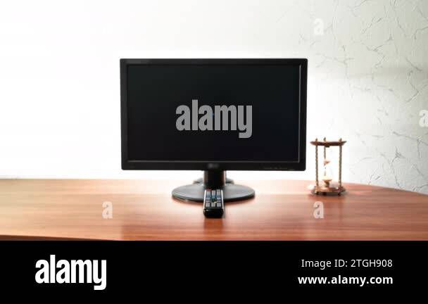 Work desk for digital job with computer, hourglass and remote control ...