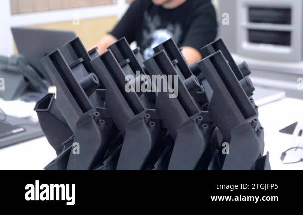 Black model printed on 3D printer in laboratory office. Object printed ...