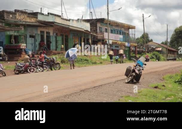 Street Life Rural Rural street in Africa. Landscape of the street on which motorcycles ...