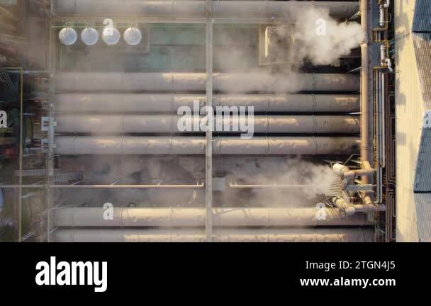 Focus on toxic fumes spread from the roof of an industrial plant ...