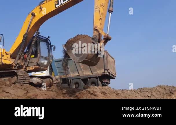 Jcb excavator digger loading tipper Stock Videos & Footage - HD and 4K ...