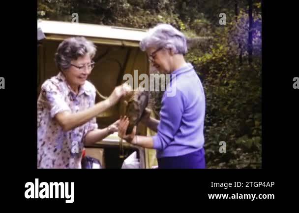 Annapolis, United States may 1966: Old ladies load the trunk of the car ...