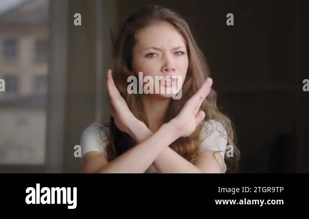 Close-up female portrait young caucasian woman showing prohibition sign ...