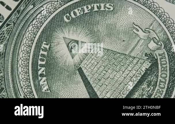 The all-seeing eye sign rotates on a one dollar bill close-up. Mason ...
