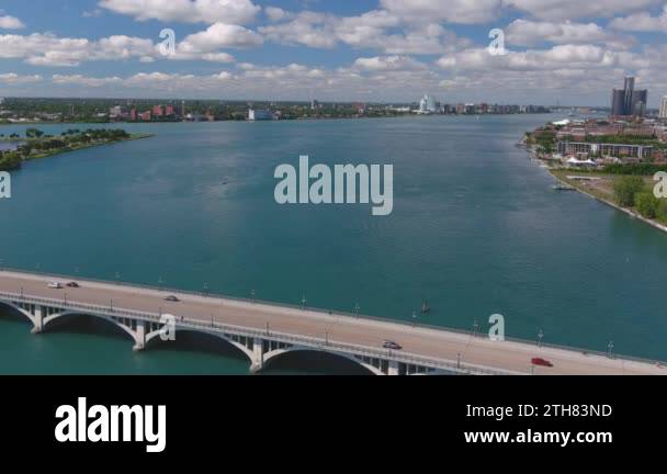 Establishing shot of the Douglas MacArthur Bridge over the Detroit ...