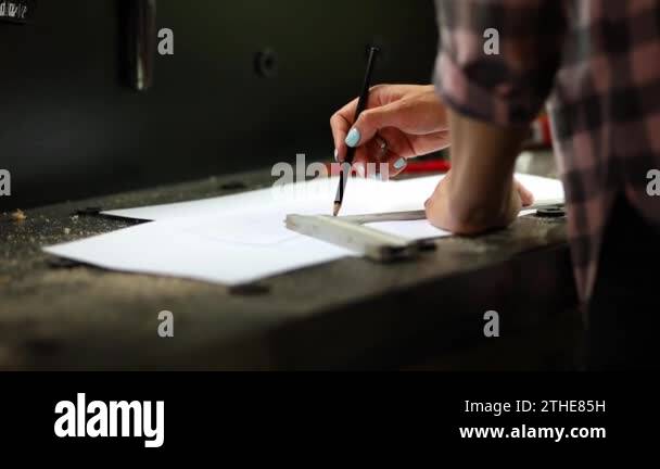 Female interior designer working on drawings, woman architect draws ...