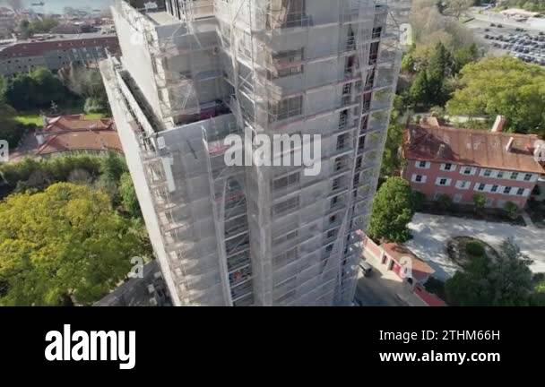 Picture of The facade of the Tall high-rise building under construction with ...